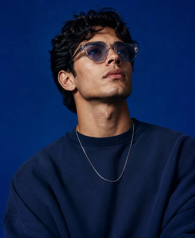 Create a high-end studio fashion portrait inspired by the...