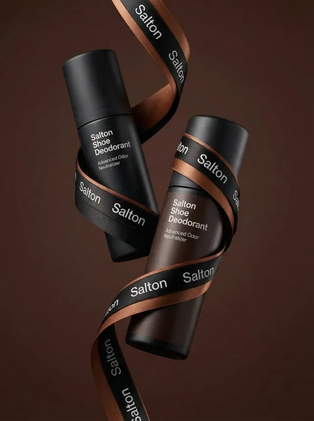 A product photo in a premium advertising style. Two tall ...
