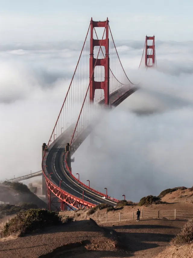 Create a surreal, photorealistic landscape of a red suspe...
