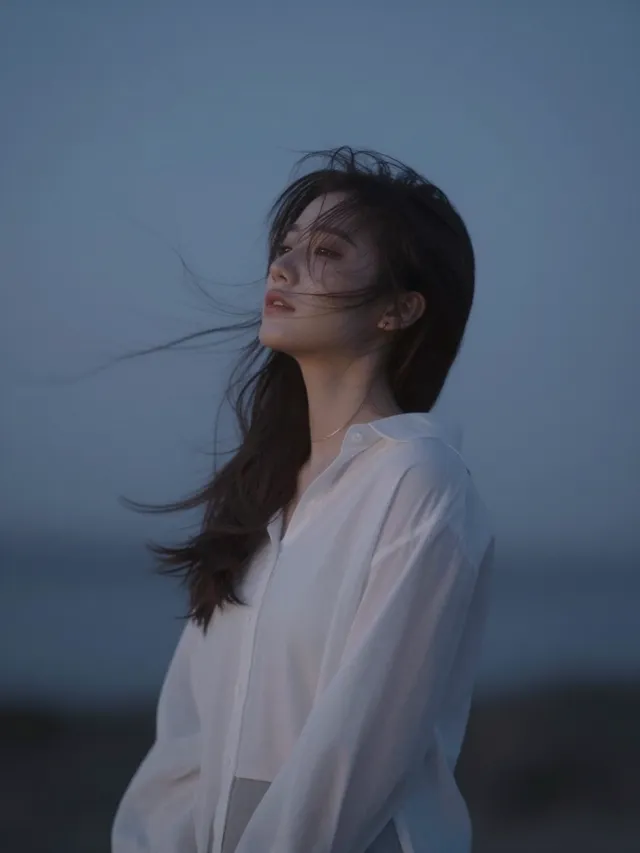 Character reacting deeply to surroundings—wind, music, si...
